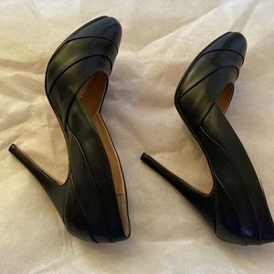 Black Christian Louboutin round toe heels in great condition